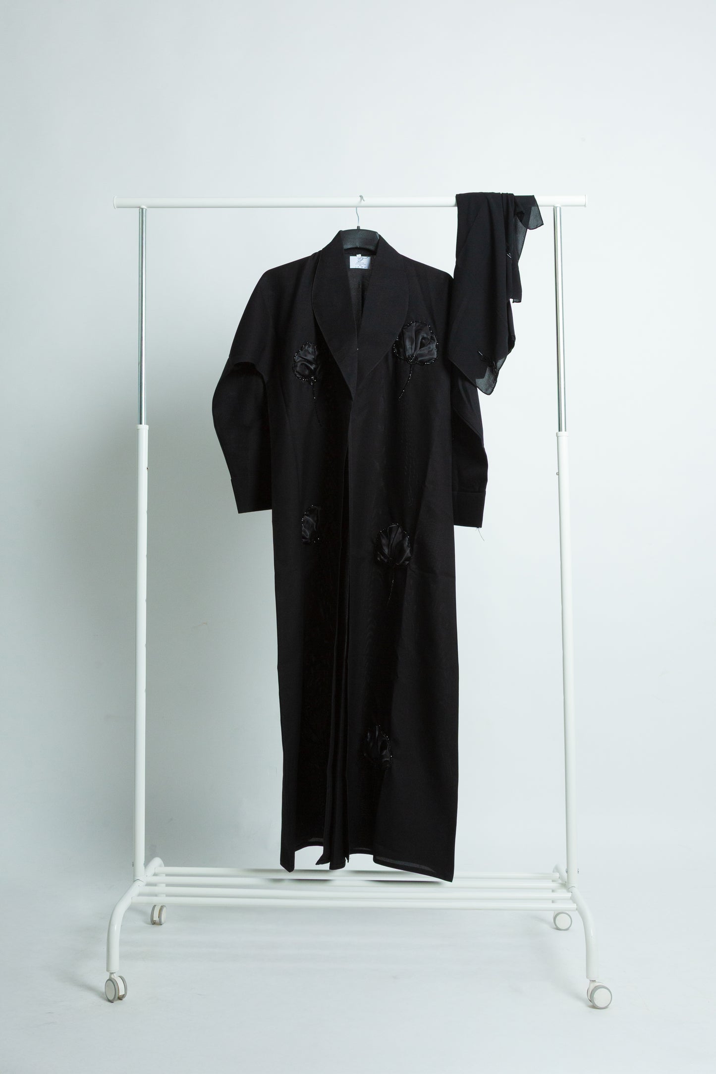 Black Abaya with Shiny Floral Embroidery and Elegant Coat-Style Cut
