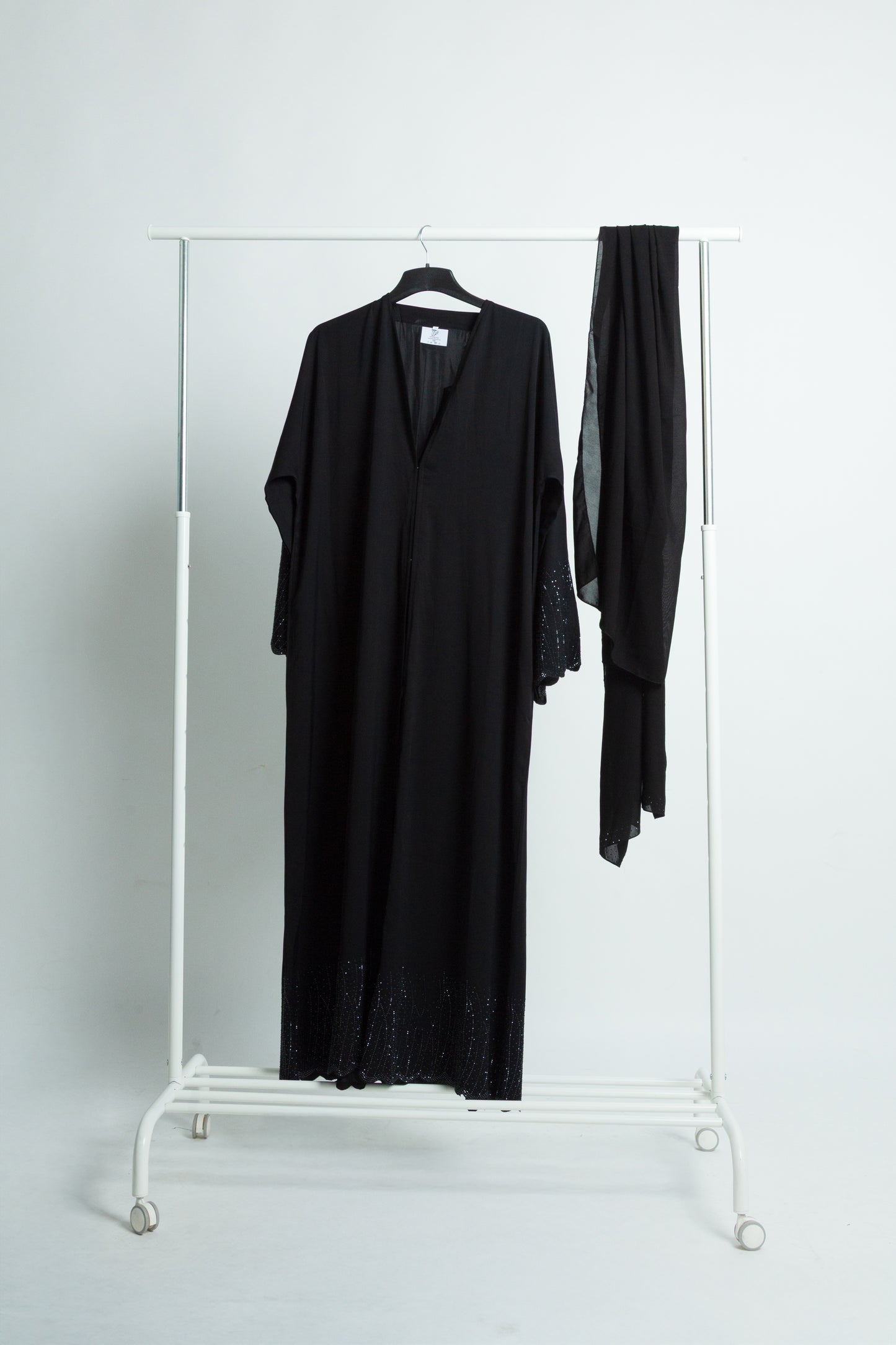 "Your black abaya reflects effortless elegance with fine embroidery and subtle sparkle.