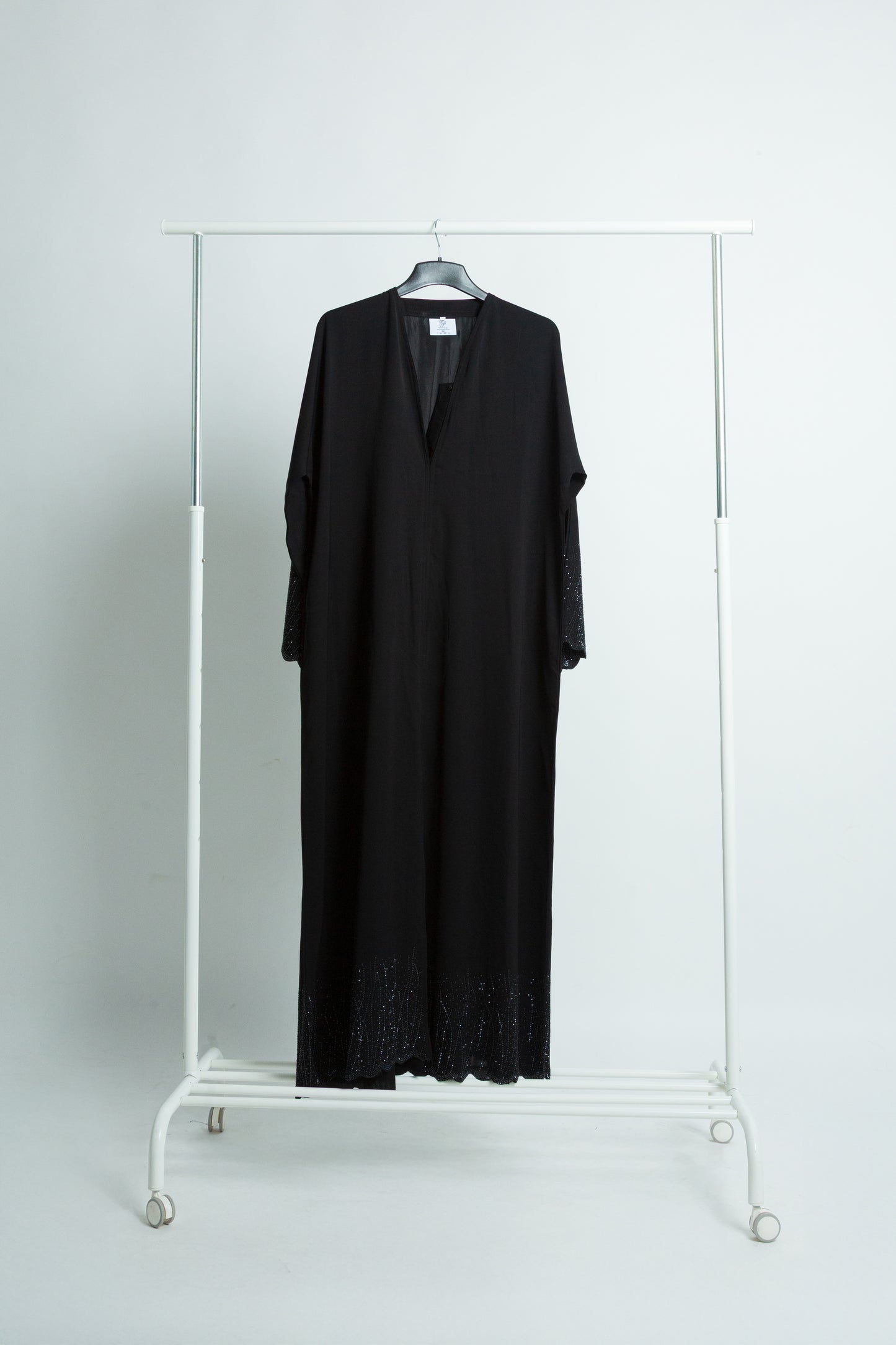 "Your black abaya reflects effortless elegance with fine embroidery and subtle sparkle.